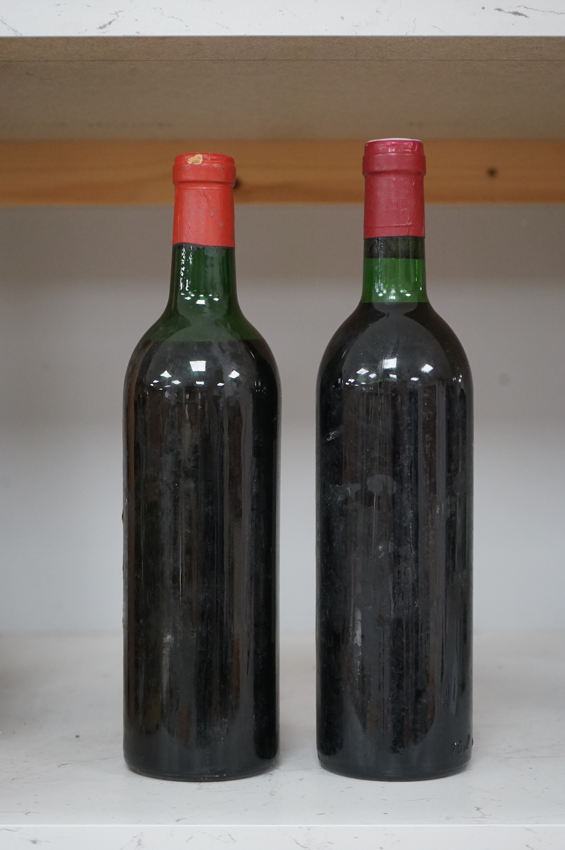 Two bottles of red wine; Chateau Troplong Mondot 1962 together with Moulin des Carruades 1978
